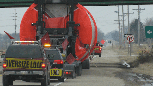 pilot car going under a bridge